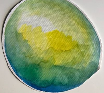 A round watercolor wash that fades from pale yellow and white at the top through soft greens to deep blue along the bottom edge.